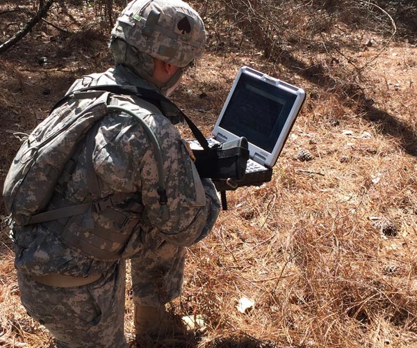military-man-on-laptop-in-the-field