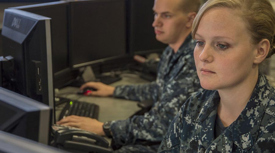 military-woman-looking-at-computer-monitor