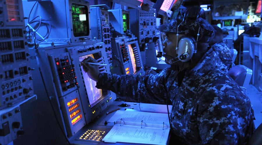 soldiers-in-mission-control-under-blue-light
